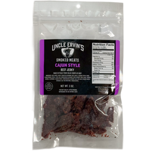 Load image into Gallery viewer, Packaged Cajun beef jerky in a clear bag with Uncle Ervin&#39;s branding
